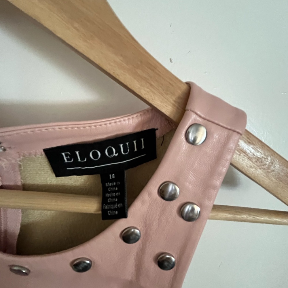 Eloquii Pink Studded faux leather dress for doms in the office.
